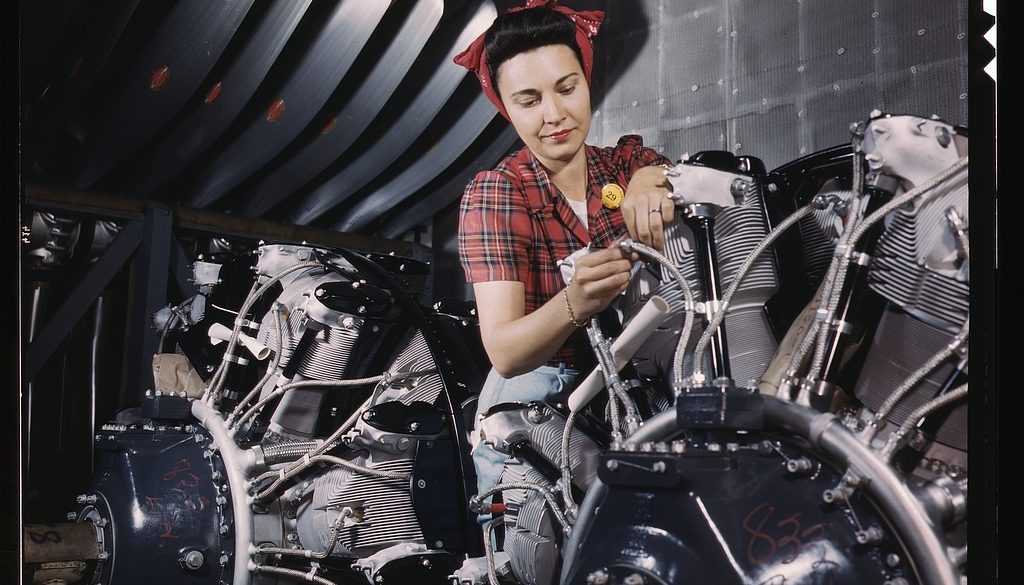 woman-working-on-an-airplane-motor-at-north-american-aviation-inc-plant-in