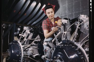 woman-working-on-an-airplane-motor-at-north-american-aviation-inc-plant-in