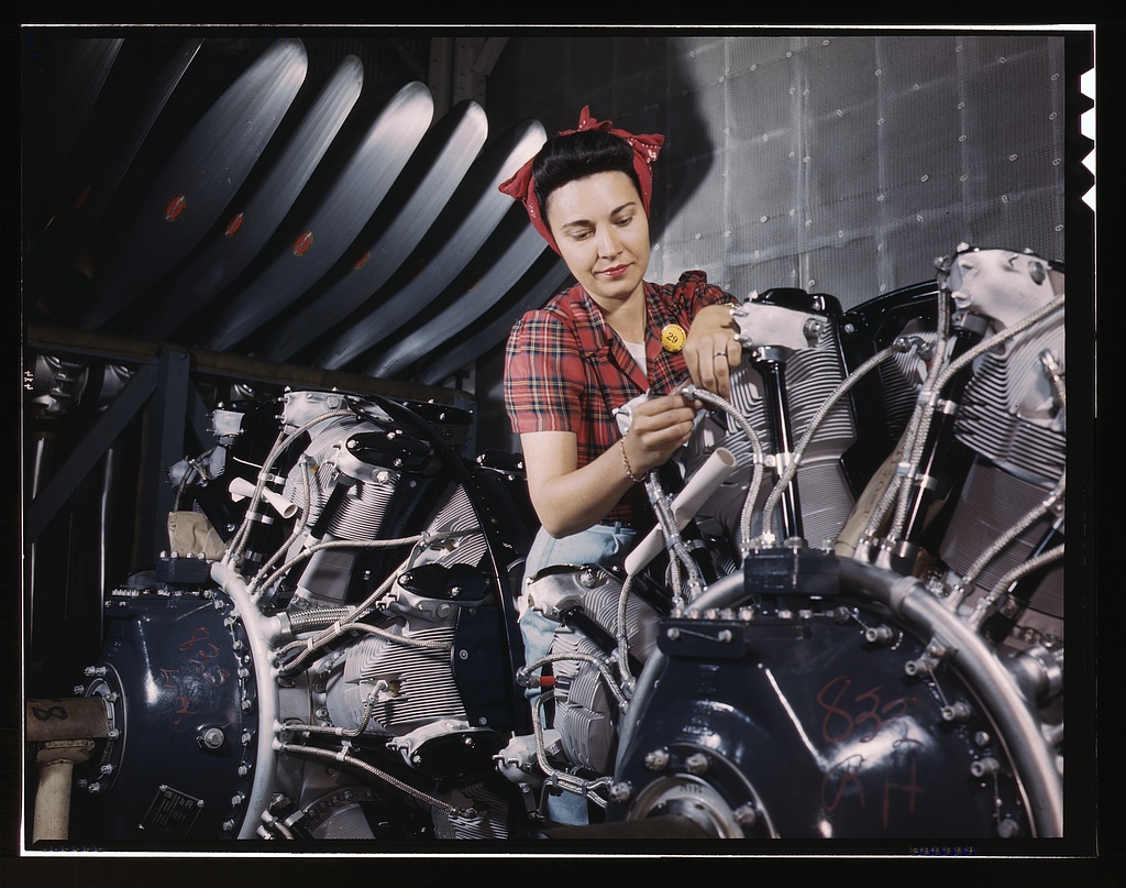 woman-working-on-an-airplane-motor-at-north-american-aviation-inc-plant-in